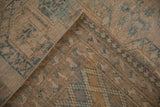 Distressed Ersari carpet showing abrashed ground, knot head wear, and machine-bound side.