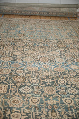 Distressed Malayer carpet field with faded floral blossoms, interconnecting vines, and dusty teal shades.