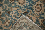 Malayer carpet showing even wear, dusty teal, brown motifs, woven foundation, and fringe.