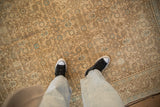 Distressed Hamadan carpet's cream, gold, powder blue Herati pattern, showing even wear.