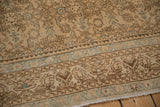 Distressed Hamadan rug pile: cream, brown geometric Herati design, powder blue accents, even wear.