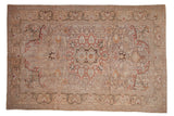 Vintage hand-knotted distressed Kayseri carpet with faded mauve star medallion, floral field, arabesque border.