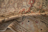 Rolled vintage Distressed Kayseri carpet revealing even pile wear and faded curvilinear arabesque patterns.