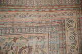 Antique Doroksh rug close-up: distressed pawn and turtle samovar borders, foundation visible.