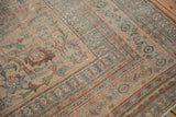 Distressed borders with sophisticated pawn and turtle samovar motifs on antique Doroksh carpet.