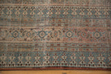 Distressed antique Doroksh border with blue turtle samovar and reciprocating pawn motifs, foundation visible.