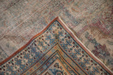 Distressed antique Doroksh rug corner with visible foundation wear and ornate sky blue pawn border.