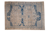 Vintage Distressed Bakhtiari carpet featuring large sapphire blue medallions and trellis on faded ivory, 7x10.