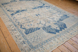 Vintage Bakhtiari carpet with distressed ivory, blue trellis pattern and machine-bound edge.