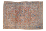 Vintage distressed Heriz carpet with a concentric medallion in faded sandalwood, sky blue, and ivory.