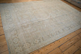Distressed vintage Mahal rug with mostly even wear, platinum, beige, and dusty teal hues.