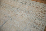 Distressed vintage Mahal rug pile, showing faded platinum, beige, and ivory tones with wear.