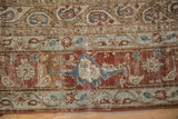Evenly worn texture on the chestnut border with floral palmettes and delicate vine details.