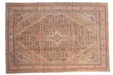 Overdyed vintage Bibikabad rug with a stepped medallion in pink, beige, and dusty blue.