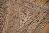Restored corner of a vintage Bibikabad rug showing the low, textured pile and spandrel.