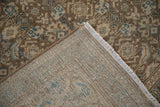 The hand-knotted foundation and weave structure on the back of a distressed Mahal rug.