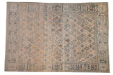 Vintage Joshegan carpet with a distressed floral lattice in dusty blues and soft mauve beige.