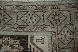 Close-up of the distressed Persian Veece carpet showing mostly even wear down to the knot heads.
