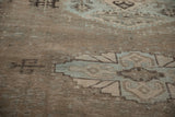 Angled view of the low pile revealing the knot heads and foundation of a distressed rug.