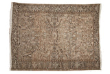 Distressed vintage Heriz carpet, allover geometric floral patterns, earthy browns, beige, and soft blue.
