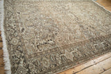 Distressed Heriz rug fringe, geometric border, and worn knot heads with soft abrashes.