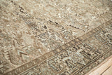 Detail of distressed Heriz carpet, showing geometric field and turtle samovar border motif.