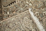 Hand knotted distressed Heriz pile with geometric vines, subtle abrashes, fringe.