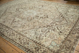 Large quatrefoil medallion and distressed field on a vintage Mehrivan carpet, shown from an angle.