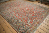 Distressed Mehrivan carpet showing scrolled leaves, vines, and turtle samovar border design.