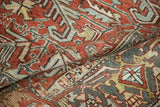 Distressed Mehrivan carpet pile with worn red-rust, pale blue-green patterns, and faint foundation.