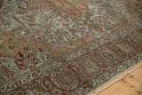 Distressed vintage Bakhtiari carpet border with palmette design and scrolling floral patterns.