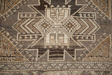 Close-up of geometric pawn motifs and hook-and-latch outlines in charcoal, silver, and antique ivory tones.