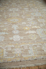Distressed Afghani Oushak carpet detail with nuanced palmettes, lotus flowers, abrashes, visible wear.