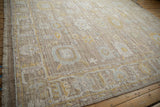 Detail of distressed Afghani Oushak carpet with worn pile, palmettes, and serrated leaf border.