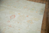 Soft distressed texture, faded madder red and pale jade green floral cross sections.