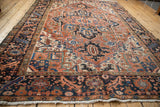 Vintage Mehrivan carpet border with navy serrated leaf and floral pomegranate, ivory fringe.