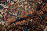 Hand-knotted Mehrivan carpet pile detail with brick red, navy, and sand geometric designs.