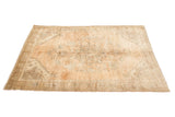 Sun-faded vintage Oushak carpet with terra cotta, blanched charcoal and beige traditional motifs.