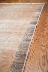 Vintage Oushak runner's distressed pile texture in two-tone beige and charcoal.