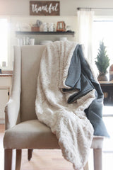 White Faux Fur Throw Blanket with soft texture and visible gray backing.