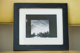 Handmade black picture frame with a flat profile and distressed vintage-style finish.