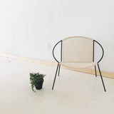 Modern Hoop and Rope Chair with black steel frame and natural woven cotton seat.