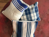 Handcrafted lavender sachets from vintage European textiles with blue, white, and pink patterns.