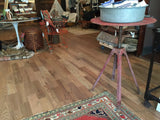 Vintage Industrial Swivel Bistro Table with distressed red metal top and tripod base.
