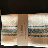 Handwoven cotton texture of the teal blue and cream striped Loomination napkin.