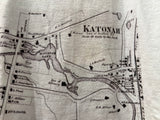 Close-up of the 1868 Katonah map print texture on a children's cotton tee.