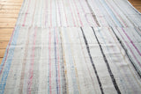 Vintage 1940s rag rug, colorful stripe dashes, soft texture, visible seam.