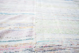 Soft woven vintage rag rug texture with pale stripe dashes and prominent central seam.