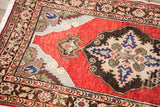 Vibrant red Turkish rug detail, showing complex floral and geometric medallion elements.