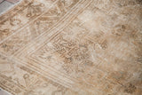 Blanched vintage Turkish Oushak rug corner, sun-faded wheat and stylized patterns.